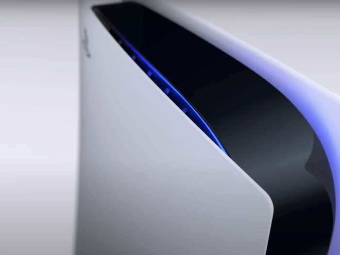 The blue glow comes from the interior space, where the black portion of the console meets the white exterior.