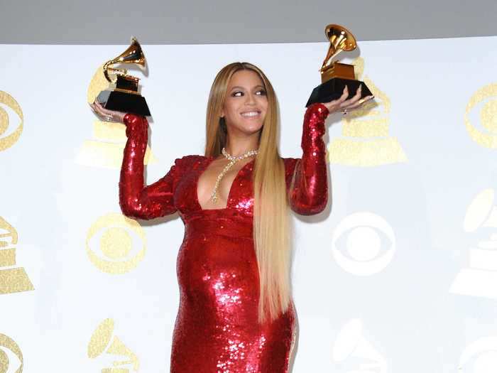 Beyoncé won two Grammy awards in a red maternity dress while pregnant with twins, Rumi and Sir.