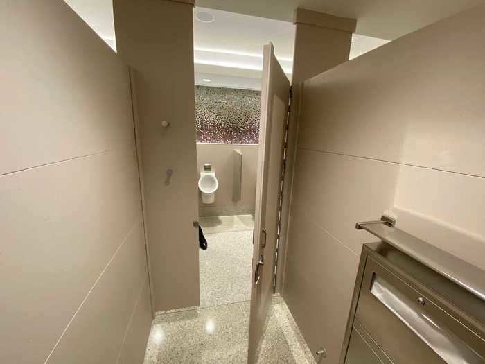 Stalls are designed to give users more space and doors are offset from the center with lips to prevent anybody from peering in.