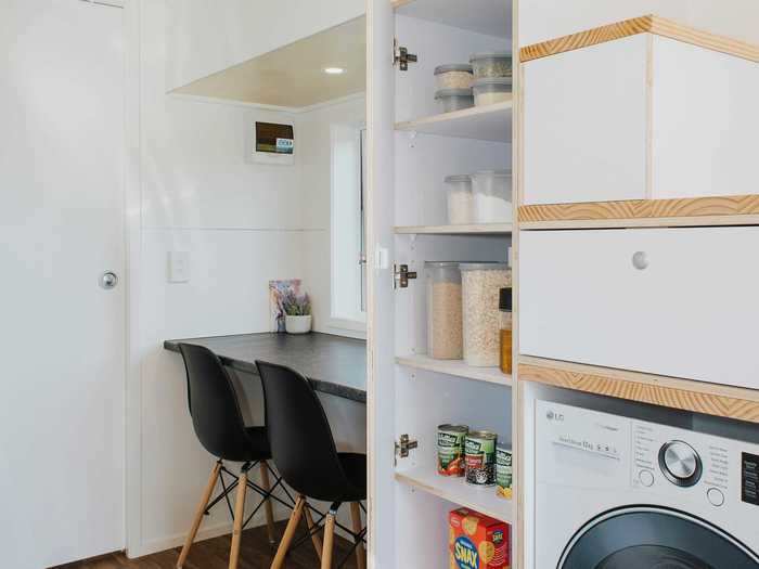 Further storage in the tiny home includes the pantry, which sits directly across from the kitchen ...