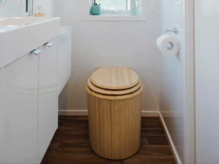 On the other side of the sliding door is a bamboo composting toilet, sink …