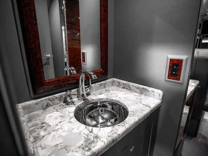 ... and a bathroom with marble counters ...