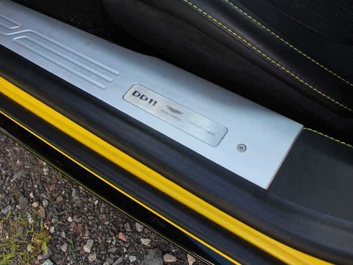 We step over this door sill plate that identifies the car — note that there are no DB11 nameplates on the exterior.