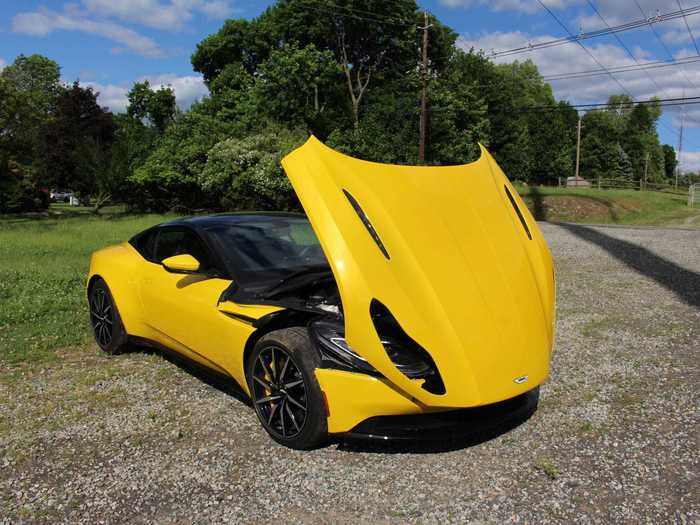 It sure is fun to pop the aluminum clamshell hood on the DB11 ...