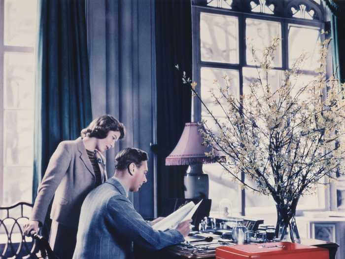 The Queen will still be able to work from home while at Windsor. Here she is with her father, King George, in one of the palace