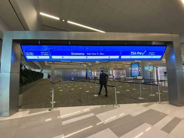 Electronic signs divide the lines with separate lanes for TSA PreCheck, families, and limited-mobility flyers.