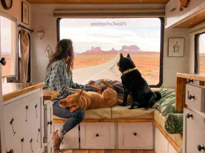 The couple has a living room at the back of the RV.