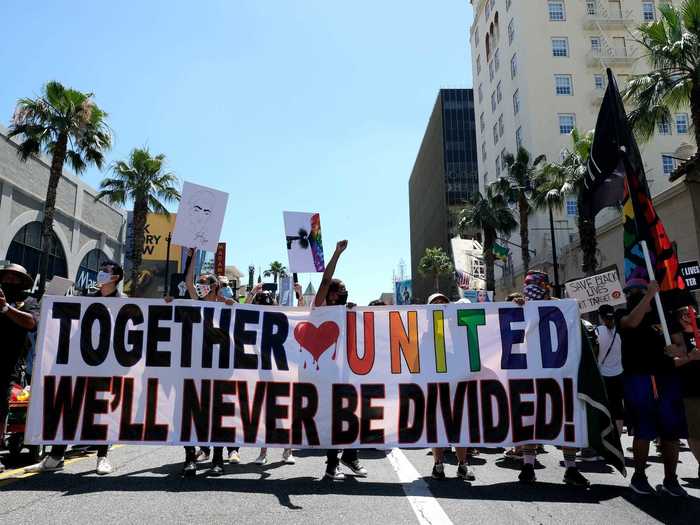 Some activists stood together with the message that "Together, United We