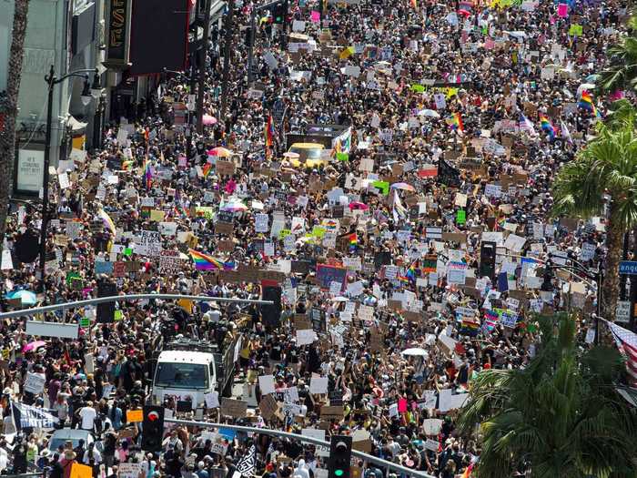 Protesters were heard chanting slogans like "Prosecute killer cops!" and holding signs to support LGBTQ+ rights, as they marched, danced, and demanded justice for discrimination and racism.