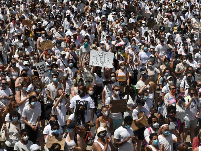 Thousands of protesters at the rally wore white to pay tribute to the 1917 "Silent Parade," in which the NAACP organized a gathering of 10,000 people to fight against violence toward Black Americans.