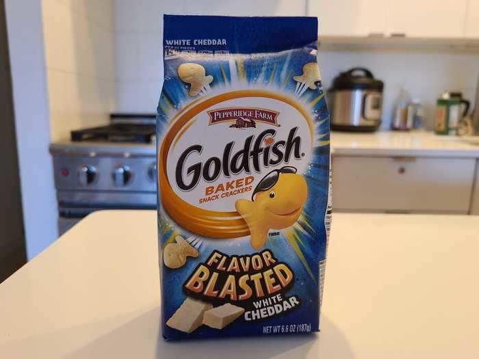 The Flavor Blasted Goldfish in white cheddar flavor are covered with fine, cheesy dust.