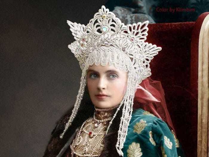 Baroness Emma V. Fredericks, the maid of honor of Their Imperial Majesties, is pictured wearing a towering beaded headdress and a fur-lined cape.