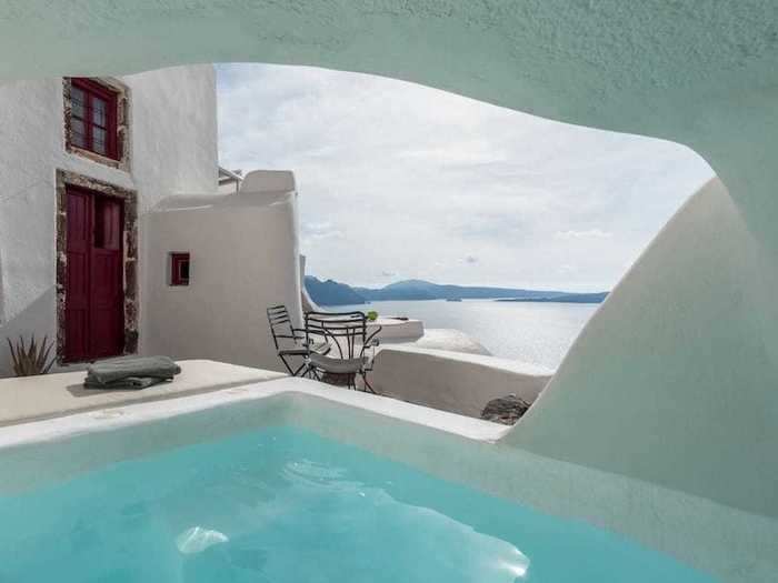 A small whirlpool overlooks the Santorini caldera, which is a submerged crater filled with water.