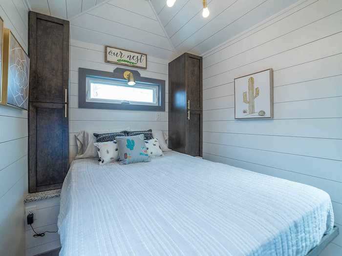 The lower master bedroom can accommodate a queen mattress and still have enough walking space around three sides of the bed.