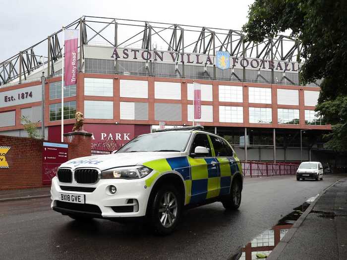 Police are present outside stadiums to ensure crowd gatherings stay strictly virtual.