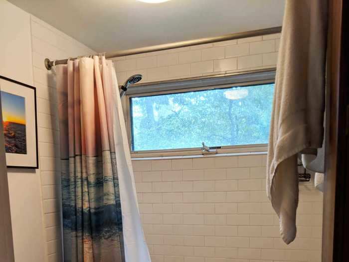 The bathroom was originally so small that it was hard to photograph. We hated the brown floor tiles.