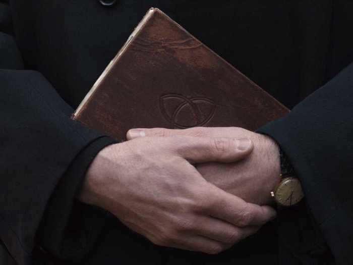 One thing to note: There is a notebook with a trinity knot (or "triquetra") symbol on its cover, which seems to hold a complete account of all the time traveling and cycles people undergo.