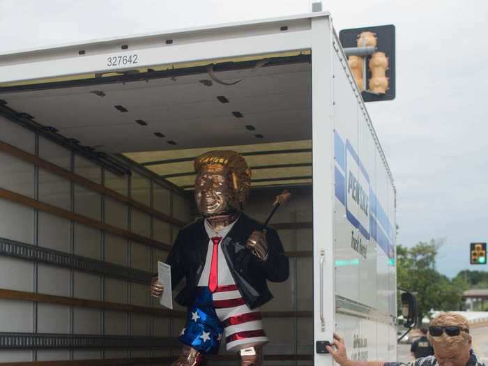 Artist Tommy Zegan brought his stainless steel sculpture, "Trump and His Magic Wand" to the rally. Zegan hopes to have it one day displayed in the Trump presidential library.