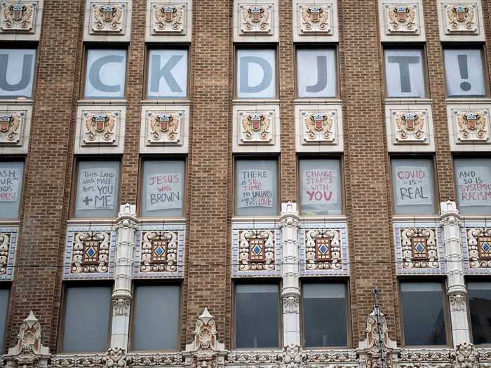 Not everyone in Tulsa is supportive of the rally. Opponents put signs in the window of a nearby building.