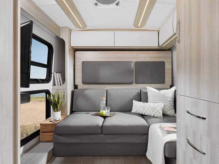 The van has an updated ceiling with built-in LED lights that accompany the accent lights across the build. This provides brightness at night or when the built-in window shades are pulled down.