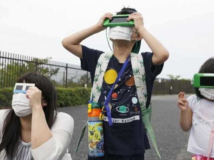 People of all ages gathered to see the eclipse in Japan.