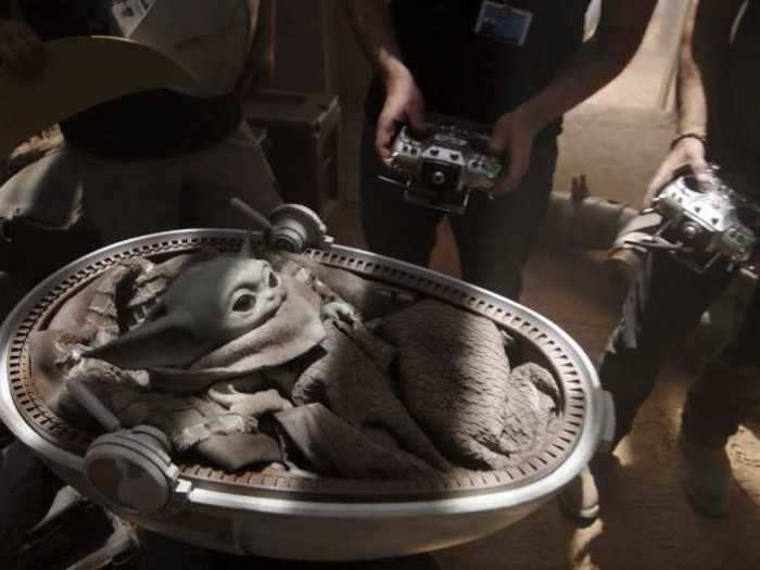 Four puppeteers operated baby Yoda.