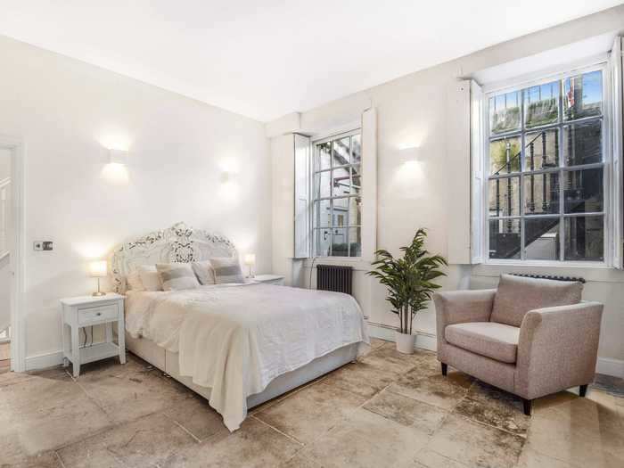 The finished Bath stone floor, pictured in the bedroom, is one of the things Barrow is "most proud of."