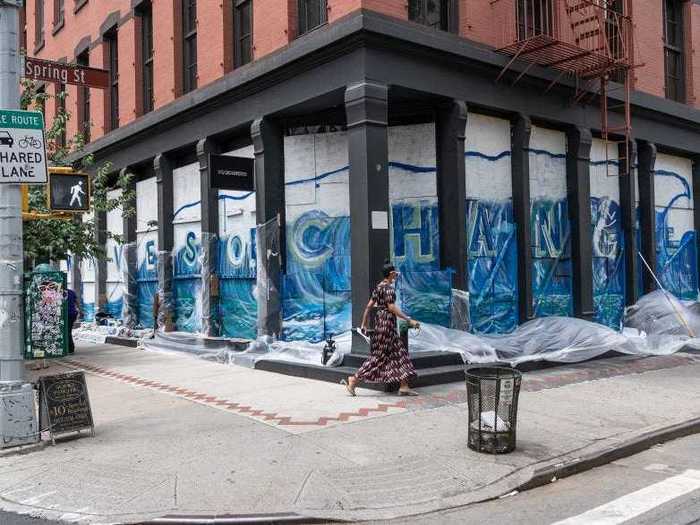 "Waves of Change" wraps around the entire corner of Spring Street and West Broadway.