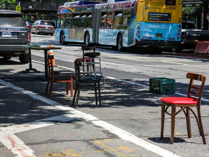 We passed by a few restaurants that seemed to be preparing to open. One restaurant had staked out a seating area by placing chairs in parking spaces.