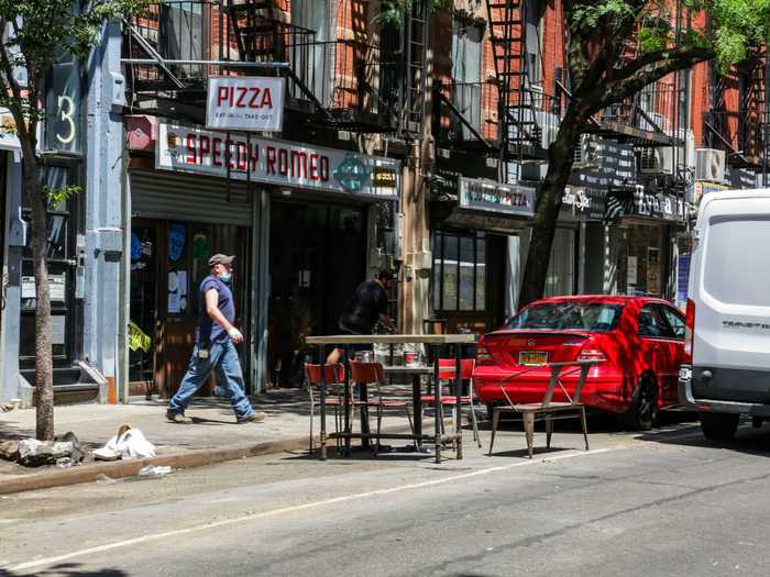 At around 11:30 am, many restaurants were still setting up their seating areas.