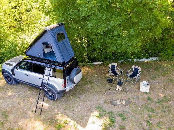 The tent also comes with pillows, an interior LED light, a stowage net, rear canopy, and a compact aluminum ladder.