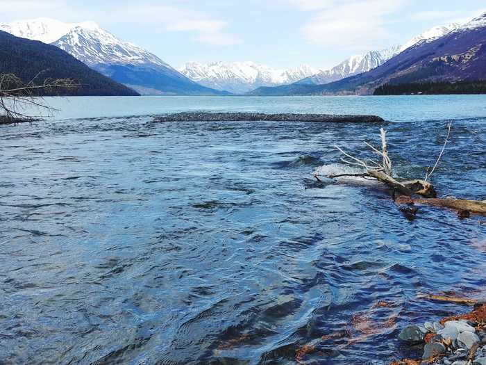 Kenai Lake in Alaska was formed from glacial water and features stunning views of the surrounding mountains.