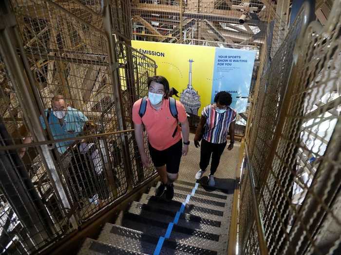 But visitors still need to follow health safety measures. For example, instead of taking an elevator to the viewing platform of the Eiffel Tower, people have to climb the (many) stairs for now...