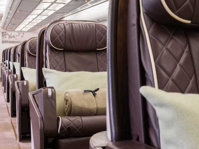 Standard amenities at each seat also include an adjustable headrest, coat hangar, and personal reading lamp, with AirX and Caledonia Jets providing hygiene kits including hand sanitizer, wipes, tissues, and a mask.