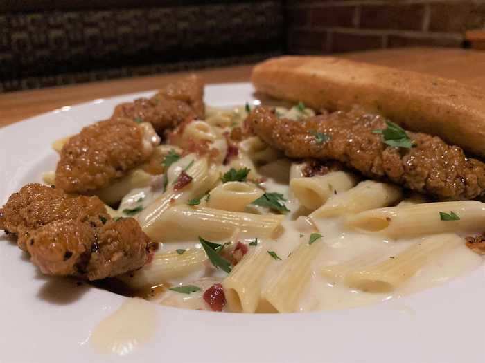 About 15 minutes later, my food arrived. I ordered the four-cheese macaroni and cheese with honey pepper chicken tenders for $13.99.