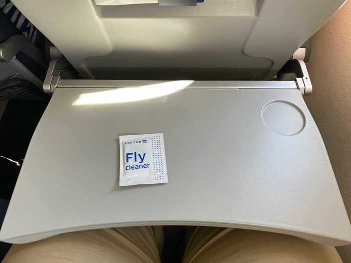 Flight attendants also distributed these sanitary wipes to passengers.