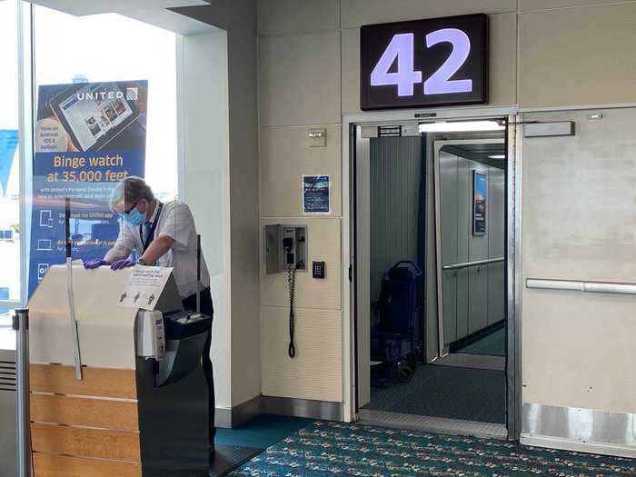 Flyers were asked to scan their own boarding pass at the podium equipped with a passenger-facing scanner and hand sanitizer station. We boarded the aircraft back to front and in groups of five.