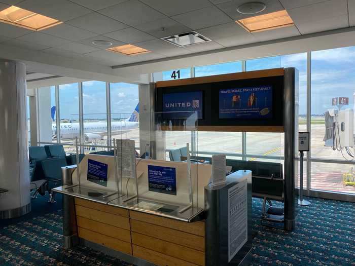 The gate area also featured the partitions separating the passengers and staff.