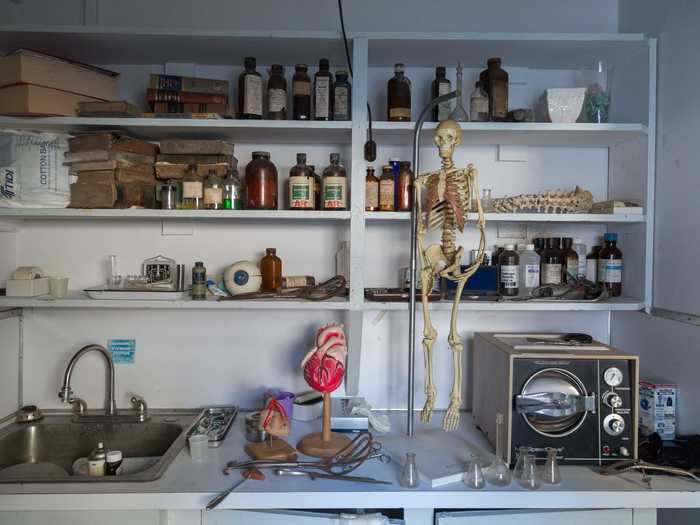 Shelving in this part of the house was filled with medicine, old books, and a real human