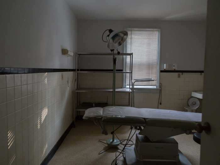 One tiled room had operating tables and equipment that were left untouched.