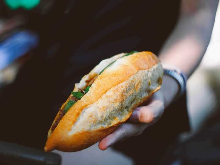 Give your hot dogs a Vietnamese twist with banh mi toppings and served in a sliced baguette.