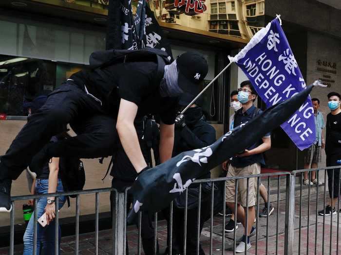 One of those arrests included a man holding a pro-independence flag, while another was a woman holding an independence sign.