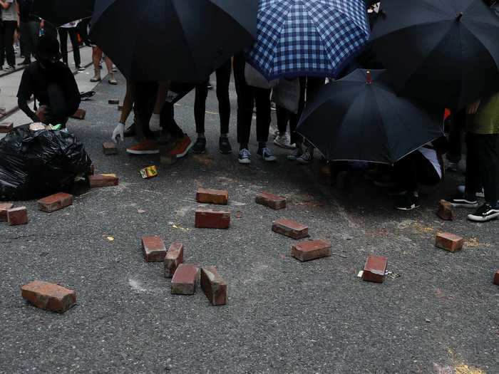 In order to try blocking the police, some protesters placed bricks throughout the roads. This tactic was used multiple times during pro-democracy protests last year.