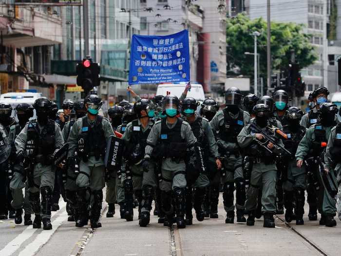 On Wednesday, protesters heading toward the Causeway Bay, a popular shopping district in the city, were met by a band of police in riot gear.