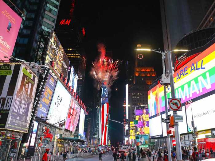 They also burst over Times Square in Manhattan while sparse crowds looked on.