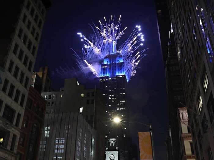 Fireworks burst over the Empire State Building in Manhattan on Independence day.