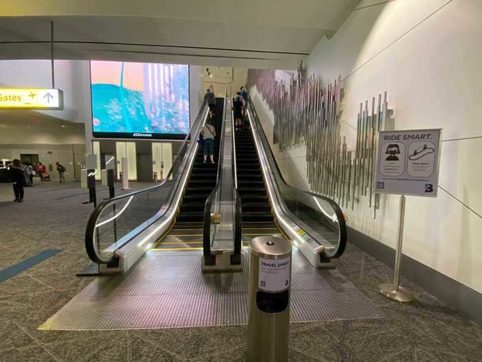 Passengers then take the escalator or elevator up to the main retail and dining space before heading to the gate.