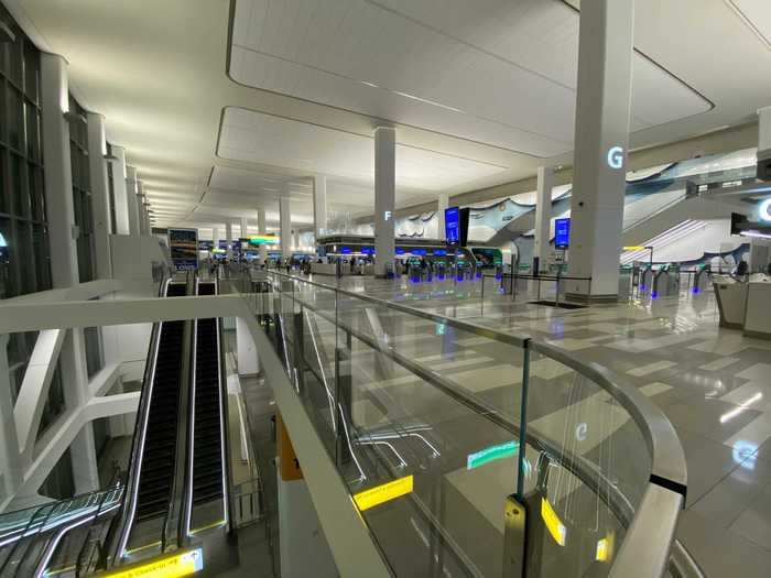 Departing passengers enter the building on the third level. Baggage claim is on the second level and a welcome center is on the first level.