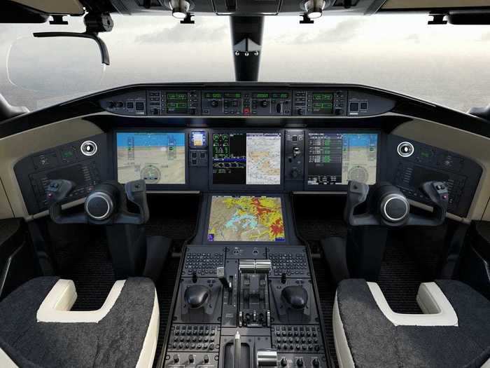 Known as the Bombardier Vision flight deck, the business end of the jet offers high-definition displays and traditional W-shaped control yokes for pilots.