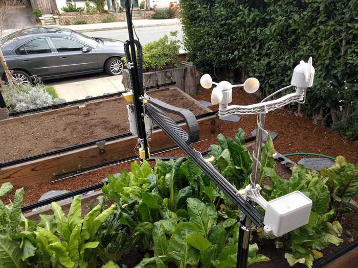 A waterproof camera takes photos of plants to monitor progress and detect weeds.